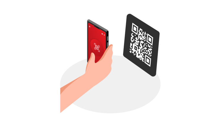 Na ilustraciji je prikazana roka osebe, ki drži pametni telefon z odprto aplikacijo za skeniranje QR kode. Pred telefonom je črna ploščica z veliko QR kodo.